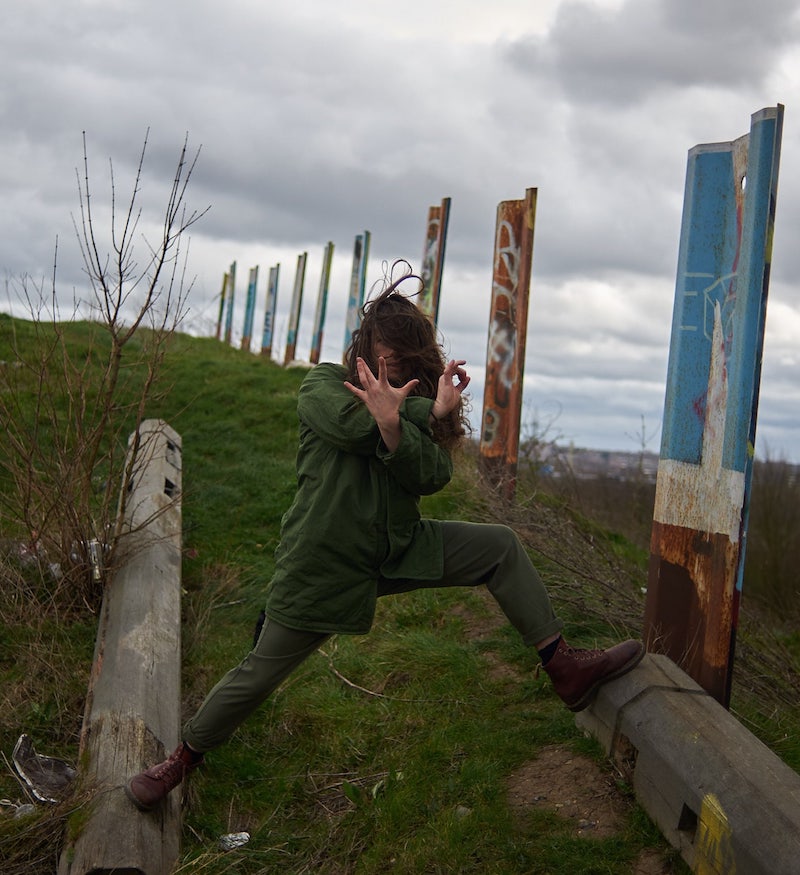 Adam striding widely in the countryside